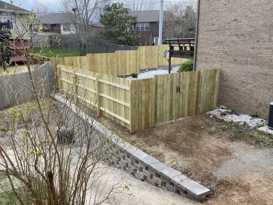 Block wall below a privacy fence, Nixa, MO