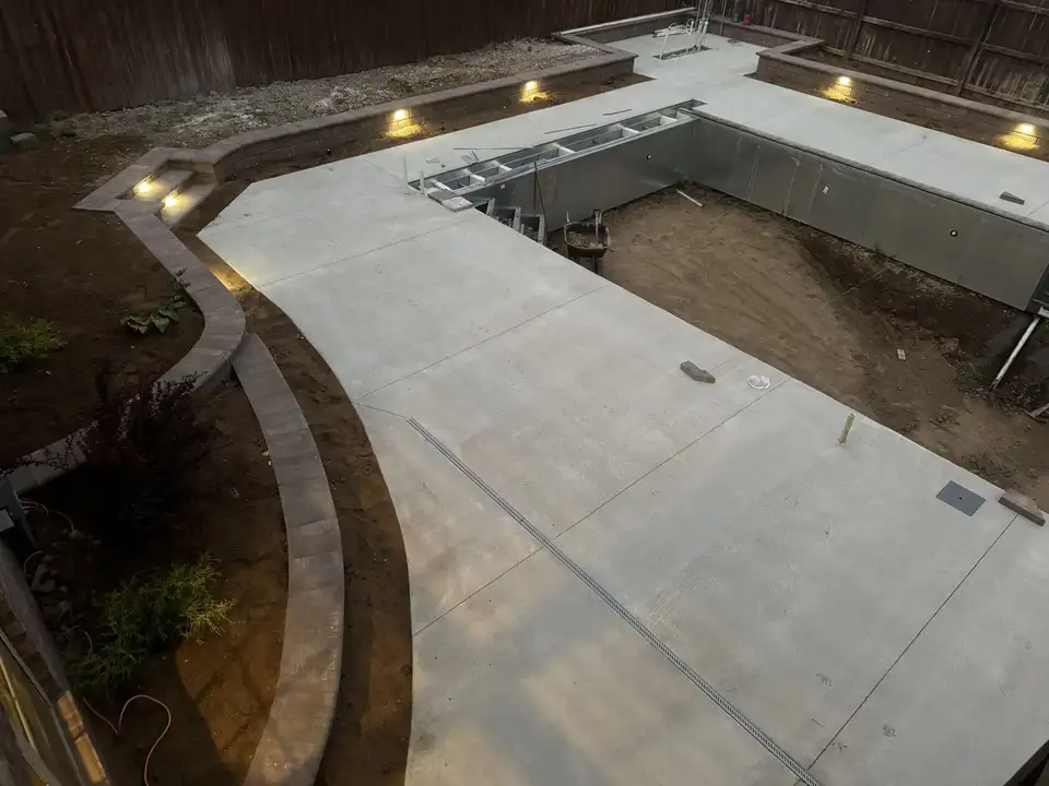 Pool deck with lights in the block walls, mid-build, one of our jobs