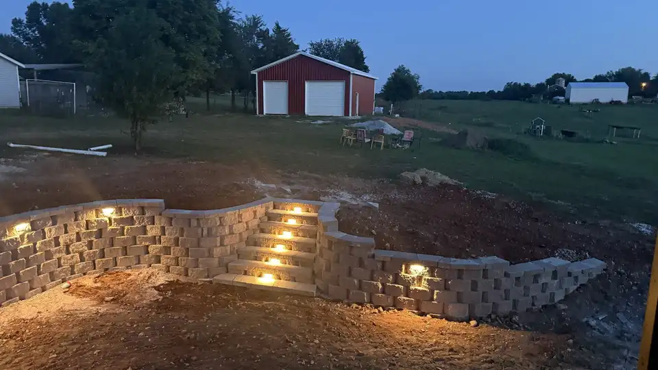After: Block retaining wall with built-in steps and lighting, Ozark, MO
